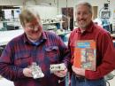 Assistant ARRL Laboratory Manager, Bob Allison, WB1GCM (left), accepts the transmitter donation from Andy Stewart, KB1OIQ.